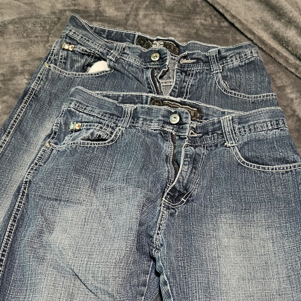 Two pairs of south pole jeans